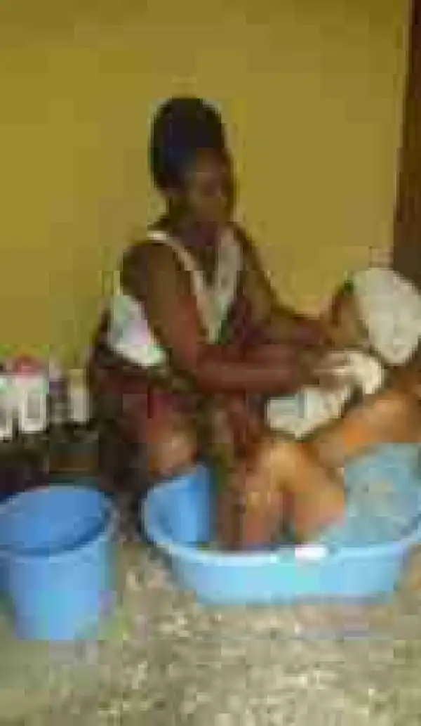 Photos Of Mother Bathing And Bottle Feeding Her Gown Up Daughter On Her Birthday Go Viral